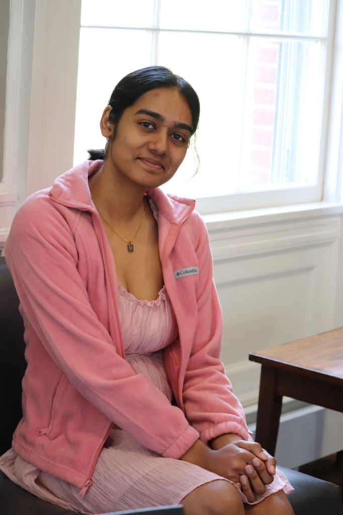 Ariti Gani sitting in front of a window