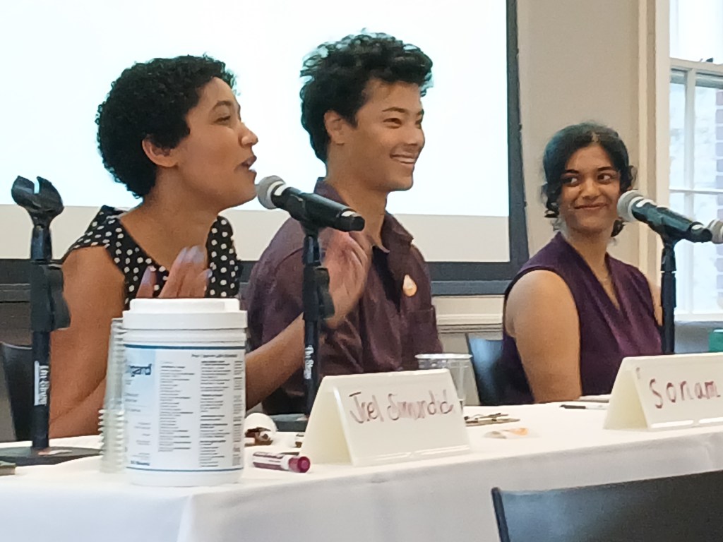 Sonam Shulman, Wesley Hackett and Avani Ghosh at a table